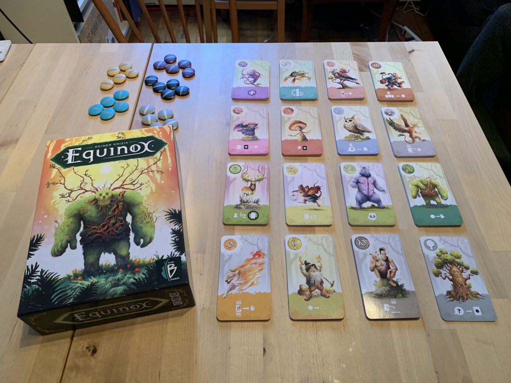 The box and cards laid out on the table.