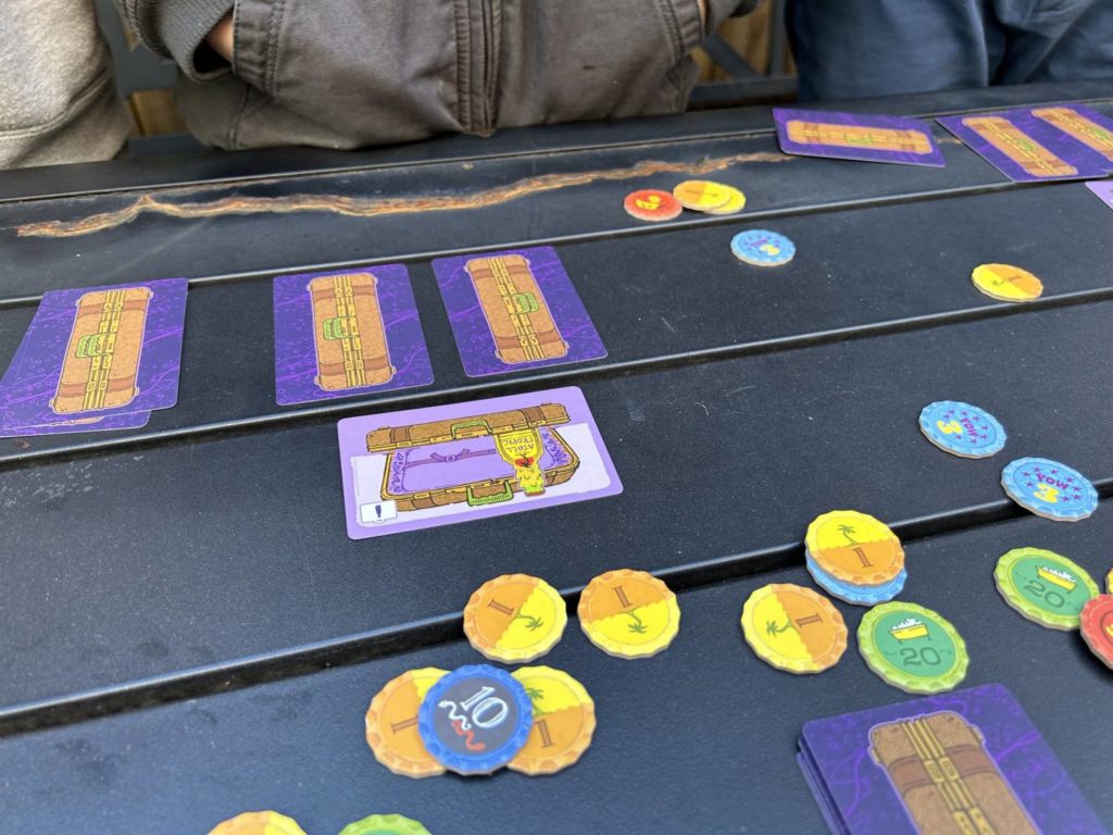 Three cards played out on the tale. Two, the facedown cards, stand tall, like pillars, while a third card sits above them,…</p>
<p>The post <a href=