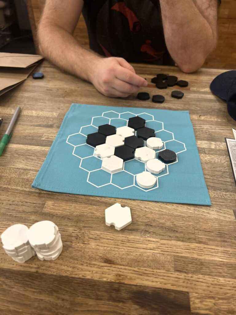 A game of Xok close to the end. Two large clusters of white site next to two smaller clusters of black…</p>
<p>The post <a href=