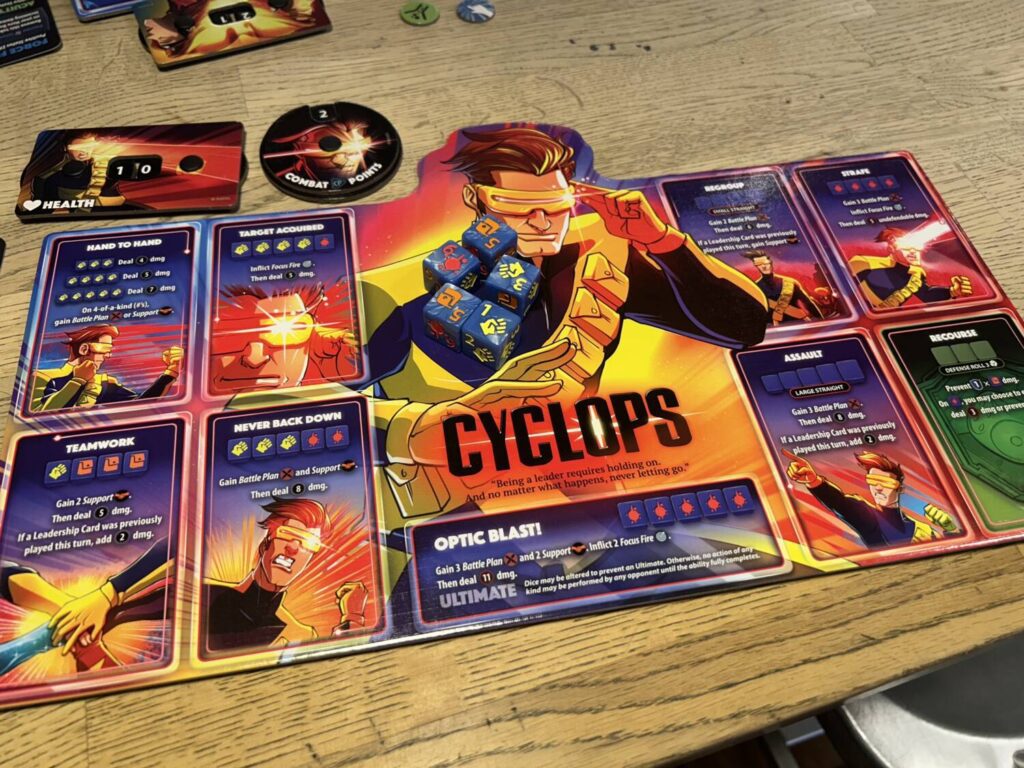 The player boards are large and rectangular, with an illustration of the character down the middle. To the left and right side, eight abilities sit in two two by two grids.