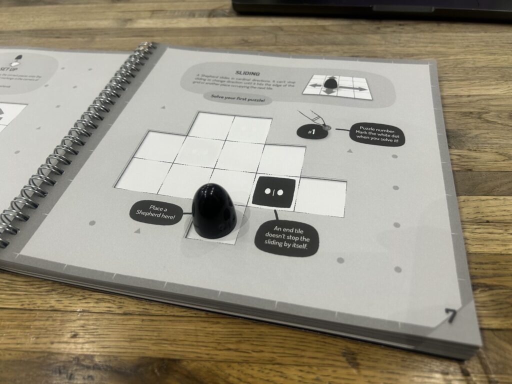 A lone black cone sits on an empty grid.